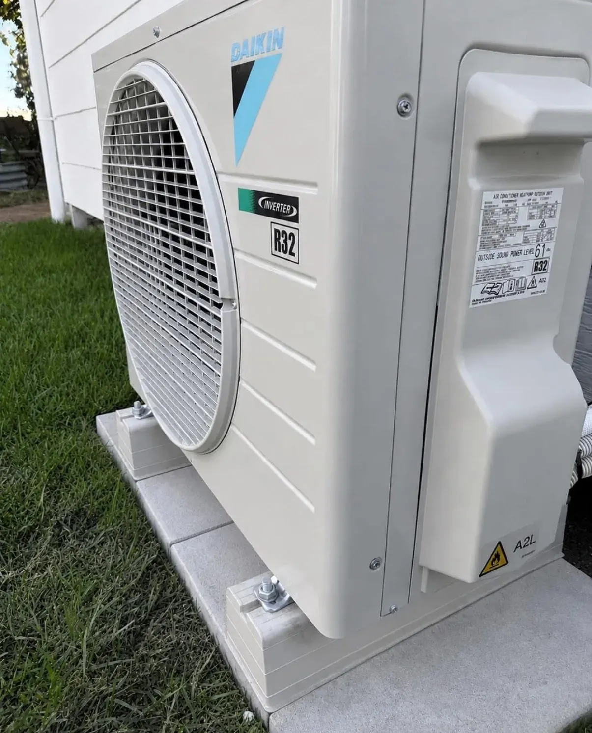 New Daikin outdoor unit installed on a concrete pad beside a home in Moama